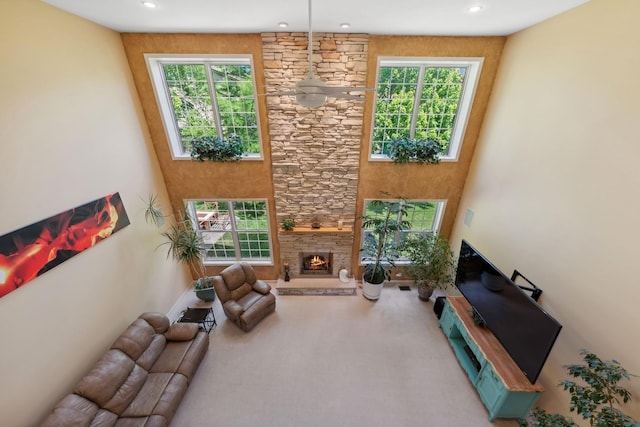 484 W Haleys Hill Ct, Palatine, IL 60074 - living room featuring a stone fireplace, recessed lighting, and carpet