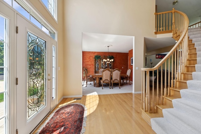 484 W Haleys Hill Ct, Palatine, IL 60074 - foyer with a high ceiling, stairs, wood finished floors, and a chandelier