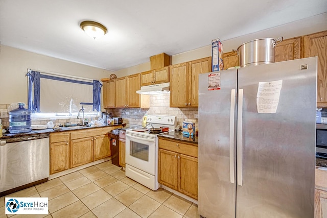 1137 Court A Dr, Hanover Park, IL 60133 - kitchen with appliances with stainless steel finishes, under cabinet range hood, decorative backsplash, and light tile patterned floors