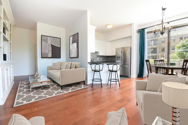 1101 S State St Unit 407, Chicago, IL 60605 - living room featuring a chandelier and wood finished floors
