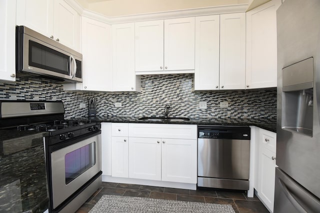 1101 S State St Unit 407, Chicago, IL 60605 - kitchen featuring stainless steel appliances, tasteful backsplash, white cabinetry, and dark stone counters