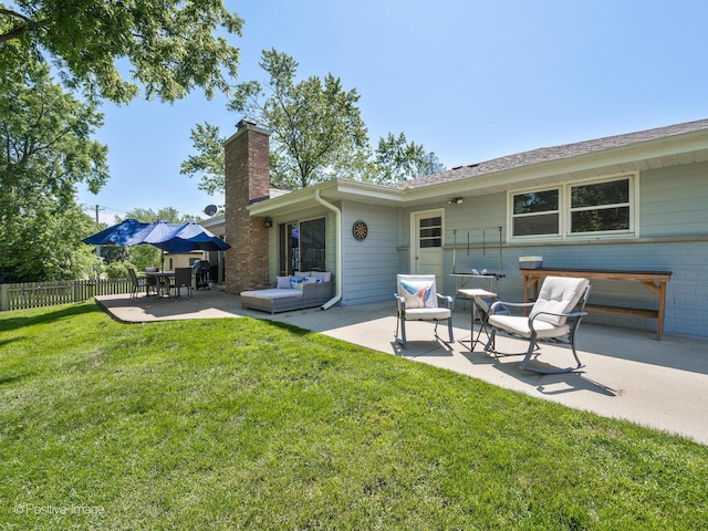711 Bryant Ave, Barrington, IL 60010 - rear view of house featuring a patio area, a chimney, brick siding, and an outdoor hangout area