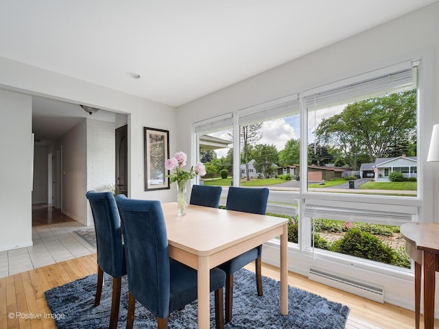 711 Bryant Ave, Barrington, IL 60010 - dining area with baseboard heating, light wood finished floors, and recessed lighting