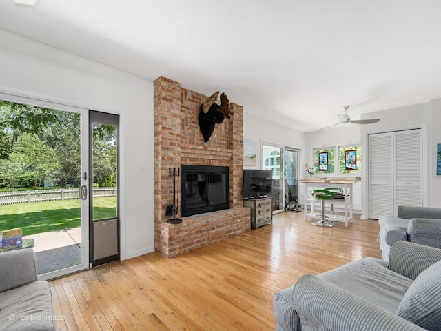 711 Bryant Ave, Barrington, IL 60010 - living area featuring a brick fireplace, wood-type flooring, and a ceiling fan
