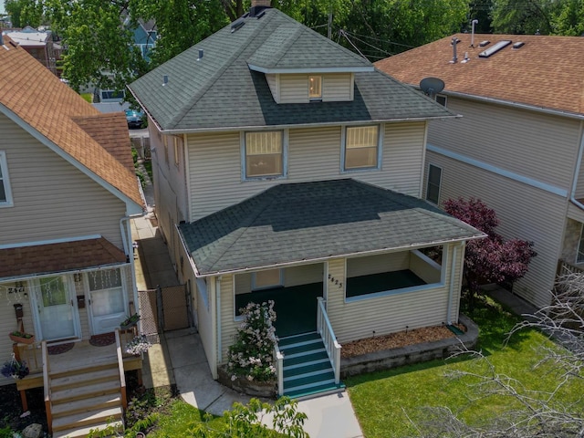 2423 Collins St, Blue Island, IL 60406 - view of front of house featuring a shingled roof, covered porch, and a gate