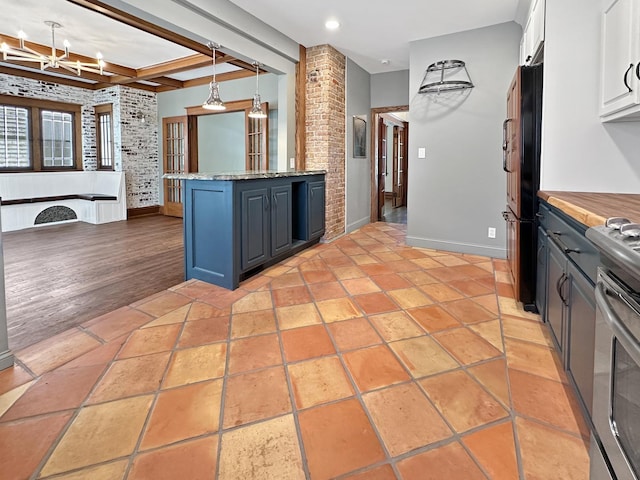 2423 Collins St, Blue Island, IL 60406 - kitchen with white cabinets, a chandelier, electric stove, freestanding refrigerator, and hanging light fixtures