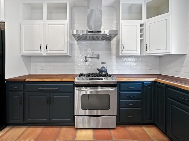 2423 Collins St, Blue Island, IL 60406 - kitchen with stainless steel gas range, wall chimney exhaust hood, open shelves, butcher block counters, and white cabinetry