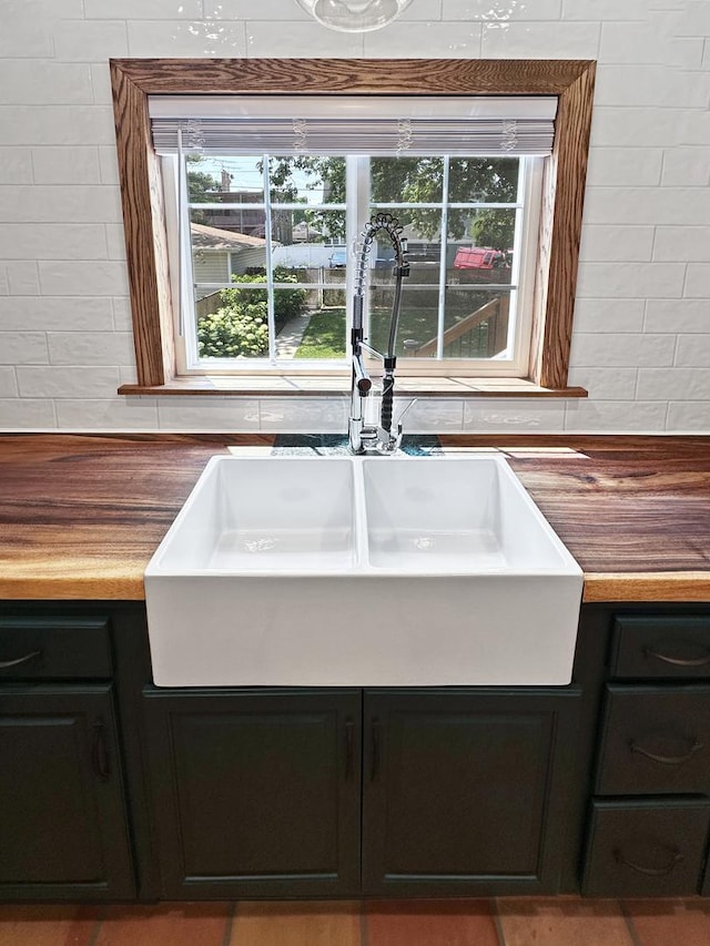 2423 Collins St, Blue Island, IL 60406 - kitchen featuring tasteful backsplash, plenty of natural light, and dark cabinets