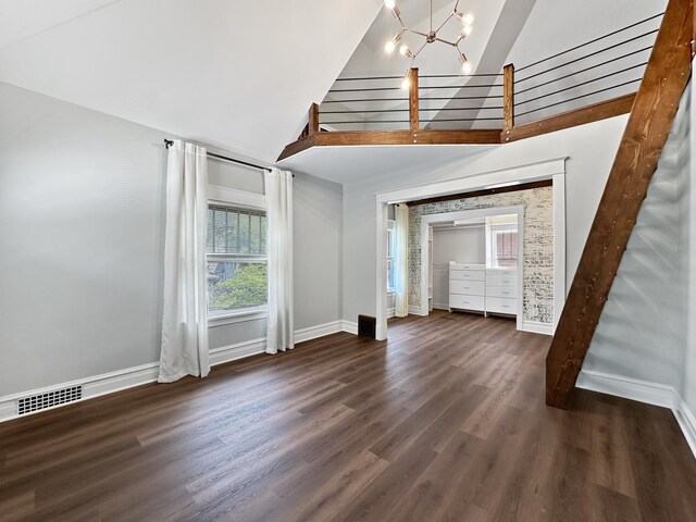 2423 Collins St, Blue Island, IL 60406 - unfurnished living room with wood finished floors, stairs, a towering ceiling, and a chandelier