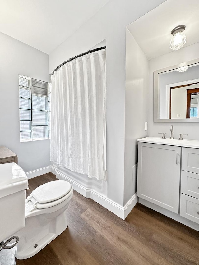2423 Collins St, Blue Island, IL 60406 - full bathroom with wood finished floors, vanity, and shower / bathtub combination with curtain