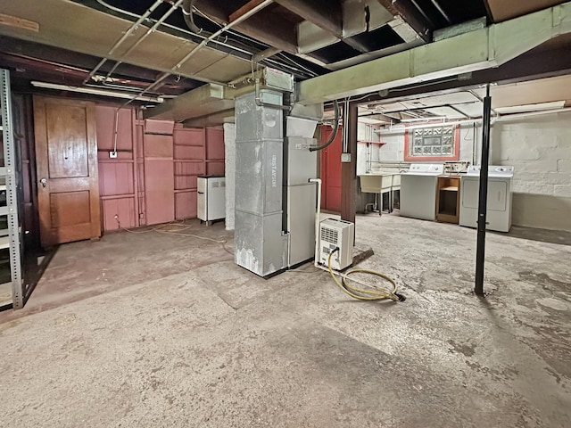 2423 Collins St, Blue Island, IL 60406 - unfinished basement featuring washer and dryer and heating unit