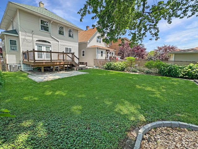 2423 Collins St, Blue Island, IL 60406 - rear view of house with a deck, a patio area, and a chimney