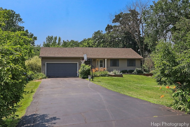 7523 Hickory, Wonder Lake, IL 60097 - ranch-style house with driveway, an attached garage, and a front yard