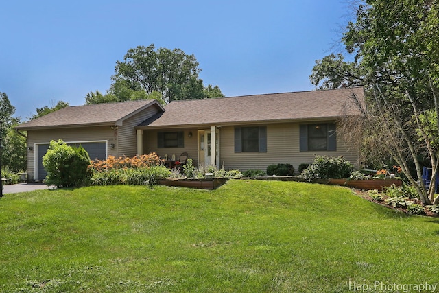 7523 Hickory, Wonder Lake, IL 60097 - ranch-style home with an attached garage, a front yard, a vegetable garden, and a shingled roof