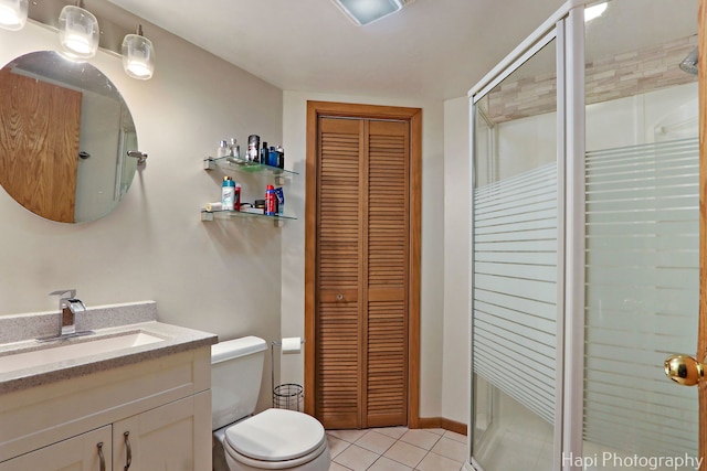 7523 Hickory, Wonder Lake, IL 60097 - bathroom featuring a closet, a stall shower, vanity, and tile patterned floors