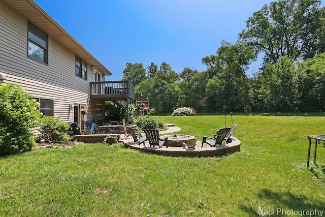 7523 Hickory, Wonder Lake, IL 60097 - view of green lawn with a fire pit and a wooden deck