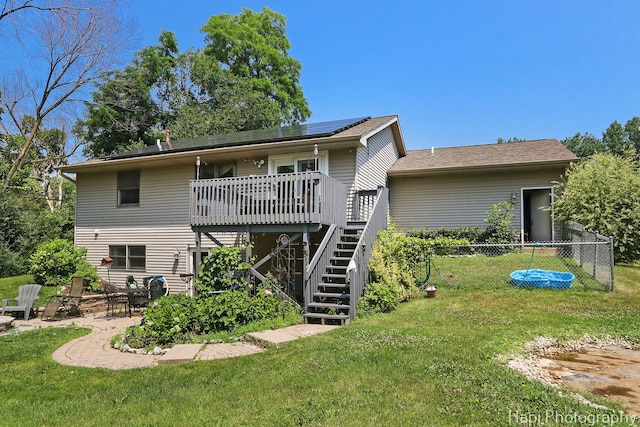 7523 Hickory, Wonder Lake, IL 60097 - back of house with stairs, a wooden deck, a patio area, and solar panels