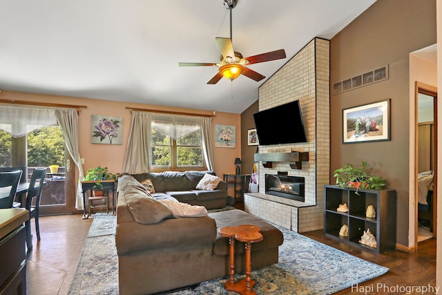 7523 Hickory, Wonder Lake, IL 60097 - living area with plenty of natural light, a ceiling fan, vaulted ceiling, and a brick fireplace