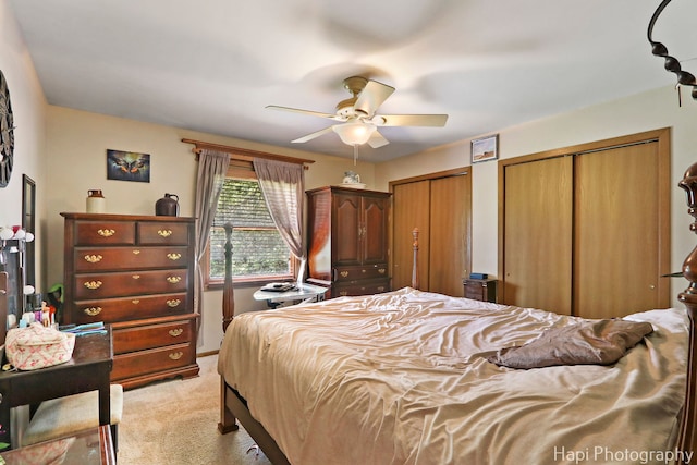 7523 Hickory, Wonder Lake, IL 60097 - bedroom featuring light colored carpet, multiple closets, and a ceiling fan
