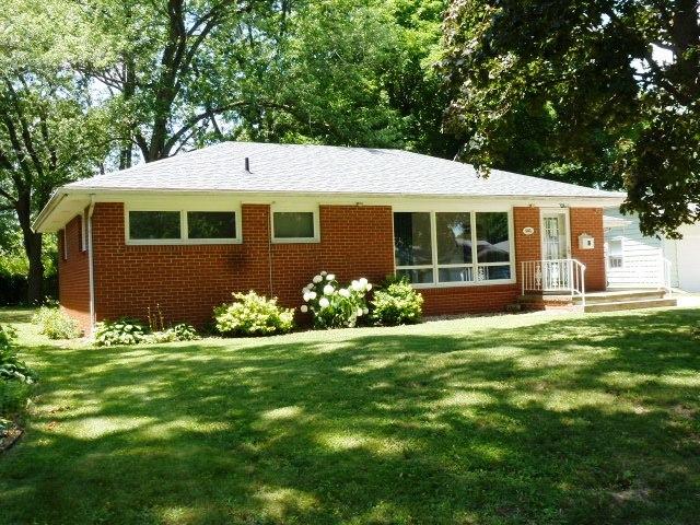 503 S Wilson St, Clinton, IL 61727 - ranch-style home with a front lawn and brick siding