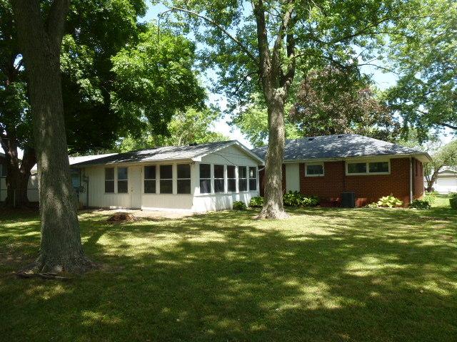 503 S Wilson St, Clinton, IL 61727 - back of house featuring a yard