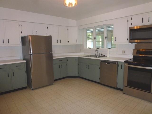 503 S Wilson St, Clinton, IL 61727 - kitchen with stainless steel appliances, light countertops, and white cabinetry