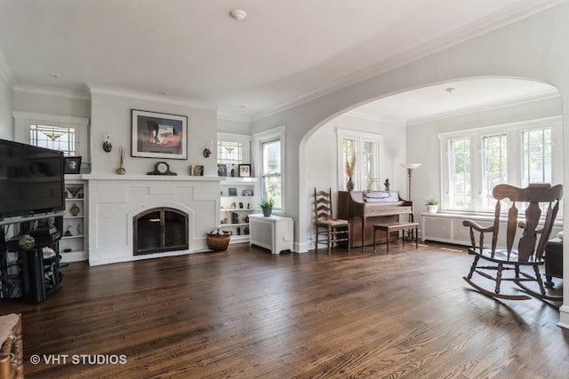 807 Fair Oaks Ave, Oak Park, IL 60302 - living room with arched walkways, wood finished floors, ornamental molding, and a fireplace