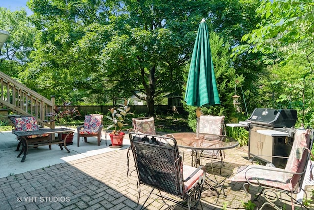 807 Fair Oaks Ave, Oak Park, IL 60302 - fenced backyard with a patio area, a grill, and outdoor dining area