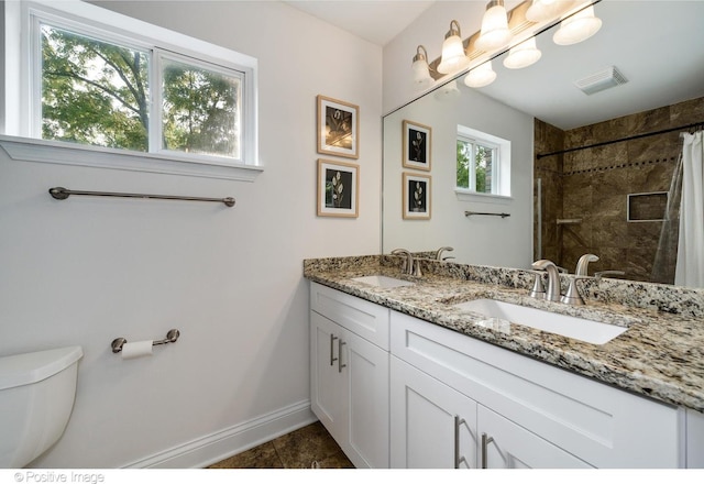 11405 191st St, Mokena, IL 60448 - bathroom featuring double vanity, tiled shower, and tile patterned floors
