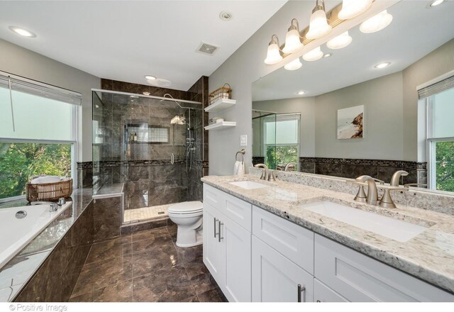 11405 191st St, Mokena, IL 60448 - bathroom with a bath, double vanity, a shower stall, and recessed lighting
