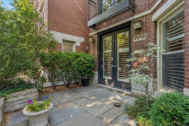 1725 N Fremont St, Chicago, IL 60614 - doorway to property featuring brick siding, french doors, a balcony, and a patio area