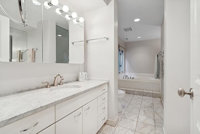 1725 N Fremont St, Chicago, IL 60614 - full bathroom featuring marble look tiles, vanity, a relaxing tiled tub, and recessed lighting