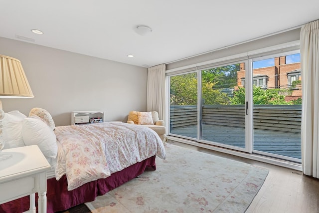 1725 N Fremont St, Chicago, IL 60614 - bedroom with access to outside, wood finished floors, and recessed lighting