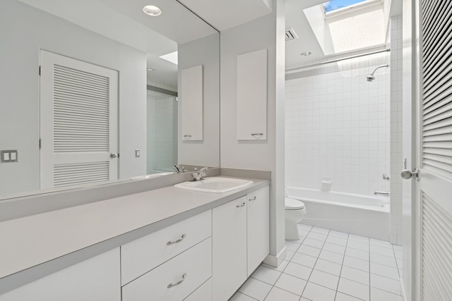 1725 N Fremont St, Chicago, IL 60614 - full bathroom with vanity, a skylight, tile patterned floors, and shower / washtub combination