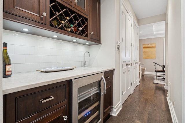 1725 N Fremont St, Chicago, IL 60614 - indoor wet bar featuring beverage cooler, backsplash, dark wood finished floors, recessed lighting, and crown molding