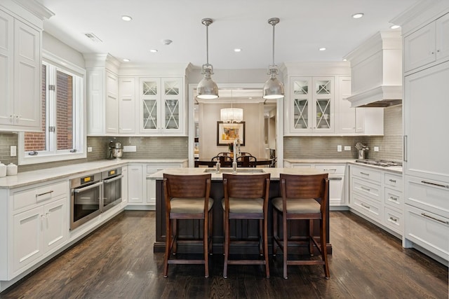 1725 N Fremont St, Chicago, IL 60614 - kitchen with stainless steel appliances, white cabinets, backsplash, and recessed lighting