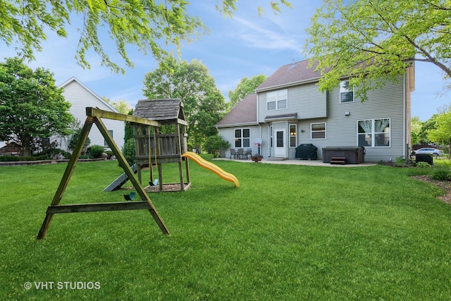 2909 Savannah Dr, Aurora, IL 60502 - back of house with a patio, a yard, a playground, and a hot tub