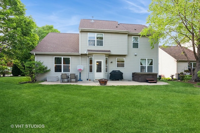 2909 Savannah Dr, Aurora, IL 60502 - rear view of house featuring a hot tub, a patio area, a lawn, and roof with shingles