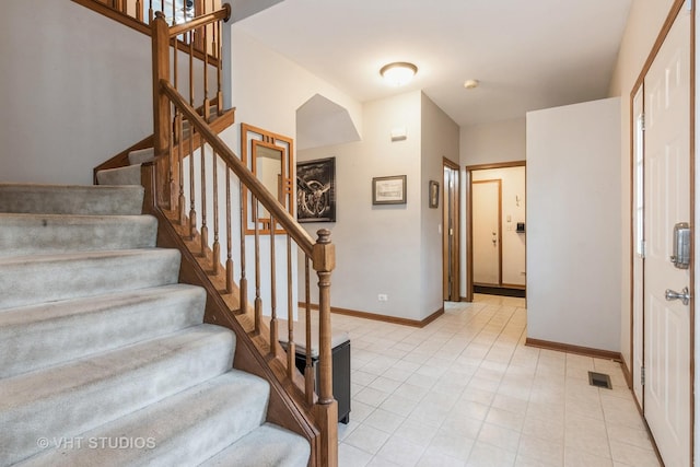 2909 Savannah Dr, Aurora, IL 60502 - stairway with baseboards and tile patterned flooring