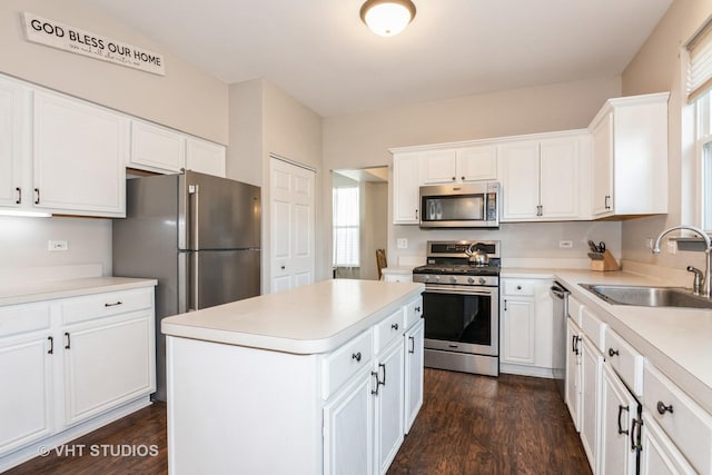 2909 Savannah Dr, Aurora, IL 60502 - kitchen with stainless steel appliances, dark wood finished floors, white cabinetry, and light countertops