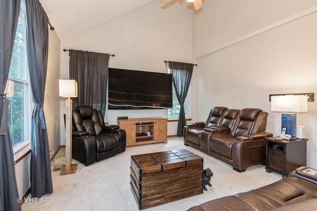2909 Savannah Dr, Aurora, IL 60502 - living area featuring light carpet, ceiling fan, high vaulted ceiling, and healthy amount of natural light