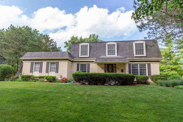 1304 W Whytecliff Rd, Palatine, IL 60067 - view of front property with mansard roof, brick siding, and a front yard