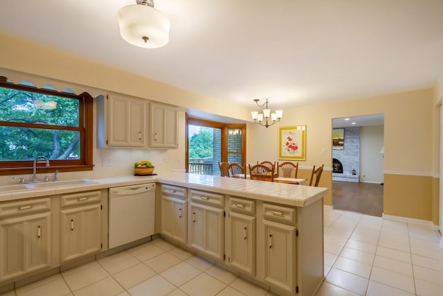 1304 W Whytecliff Rd, Palatine, IL 60067 - kitchen with dishwasher, a peninsula, a chandelier, and tile counters