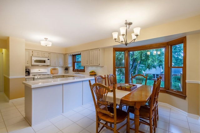 1304 W Whytecliff Rd, Palatine, IL 60067 - dining room with a chandelier and light tile patterned flooring
