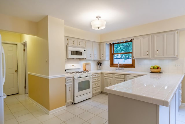 1304 W Whytecliff Rd, Palatine, IL 60067 - kitchen featuring white appliances, a peninsula, tile countertops, tasteful backsplash, and light tile patterned floors