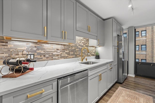 1230 N State Pkwy Unit 7D, Chicago, IL 60610 - kitchen with stainless steel appliances, dark wood-style floors, gray cabinets, and light stone countertops