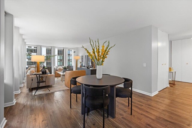 1230 N State Pkwy Unit 7D, Chicago, IL 60610 - dining space with wood finished floors and baseboards