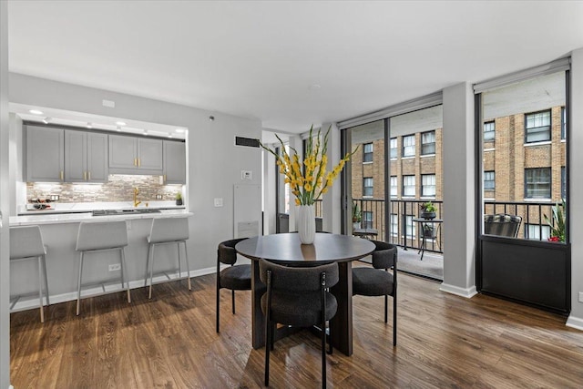 1230 N State Pkwy Unit 7D, Chicago, IL 60610 - dining area with dark wood-style floors and expansive windows