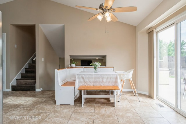 1700 Cumberland Dr, Plainfield, IL 60586 - dining space featuring lofted ceiling, stairs, ceiling fan, and light tile patterned flooring