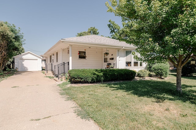 415 Swift Ave, Oglesby, IL 61348 - view of front of home featuring an outbuilding, a front lawn, driveway, and a detached garage